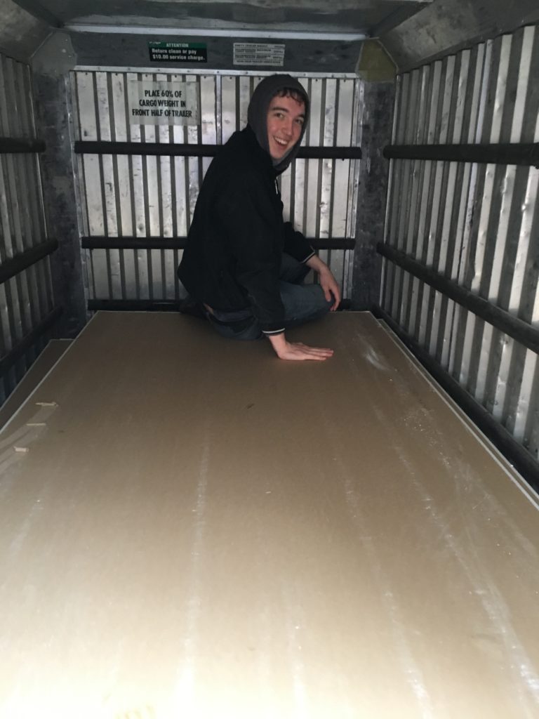 Jacob having WAY too much fun on the drywall stack in the covered trailer!