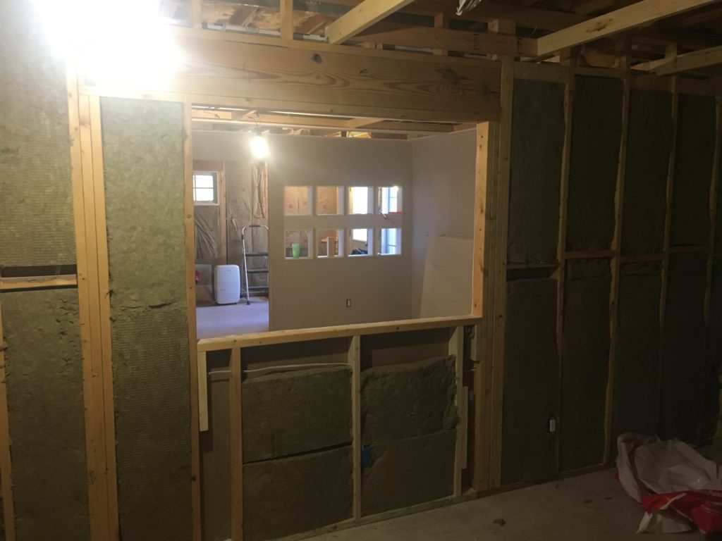 Installing Roxul insulation in basement media room
