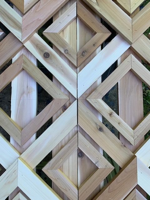 Close-up of two cedar shutters before stain.