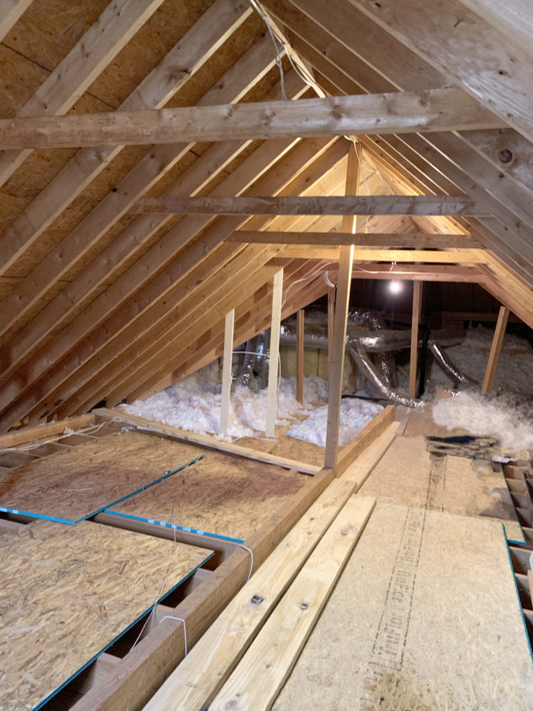 Future Finished Room Over Garage -Unfinished attic space over garage before looking back of the house.