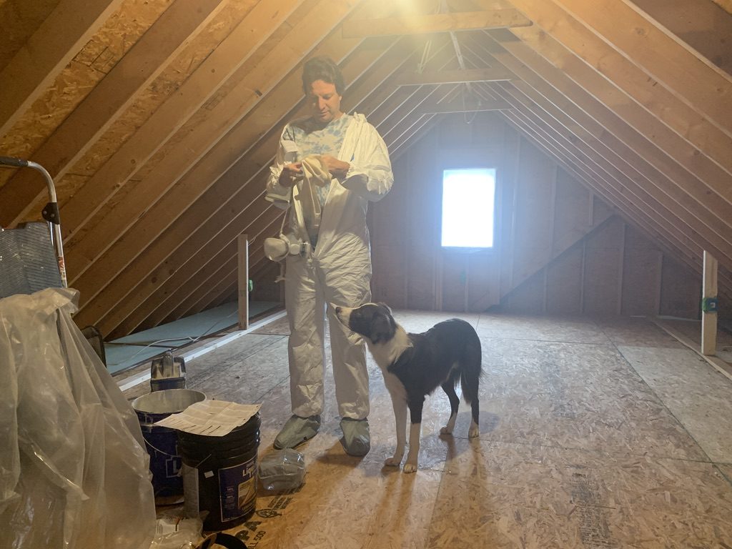 Chris getting suited up to spray liquid foil in attic