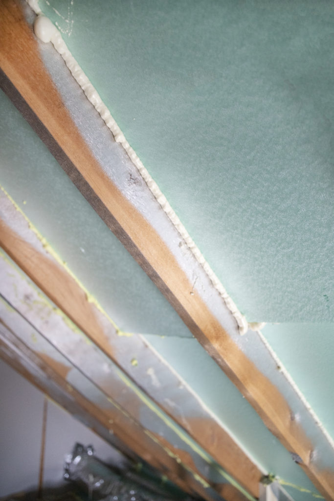 rigid foam and spray foam seams between rafters