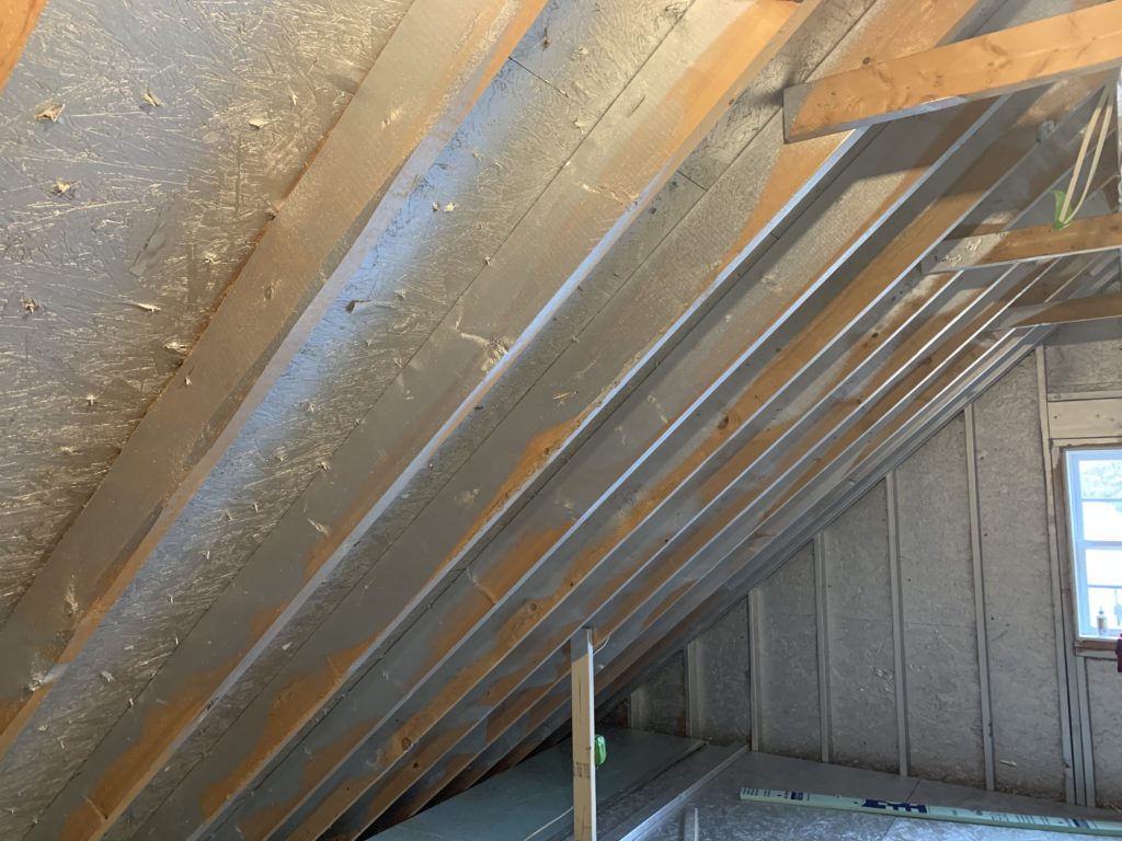 spray on liquid foil in attic rafters and roof decking