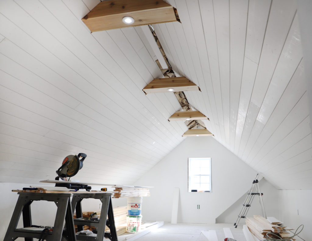 shiplap on ceiling with cedar beams attic office