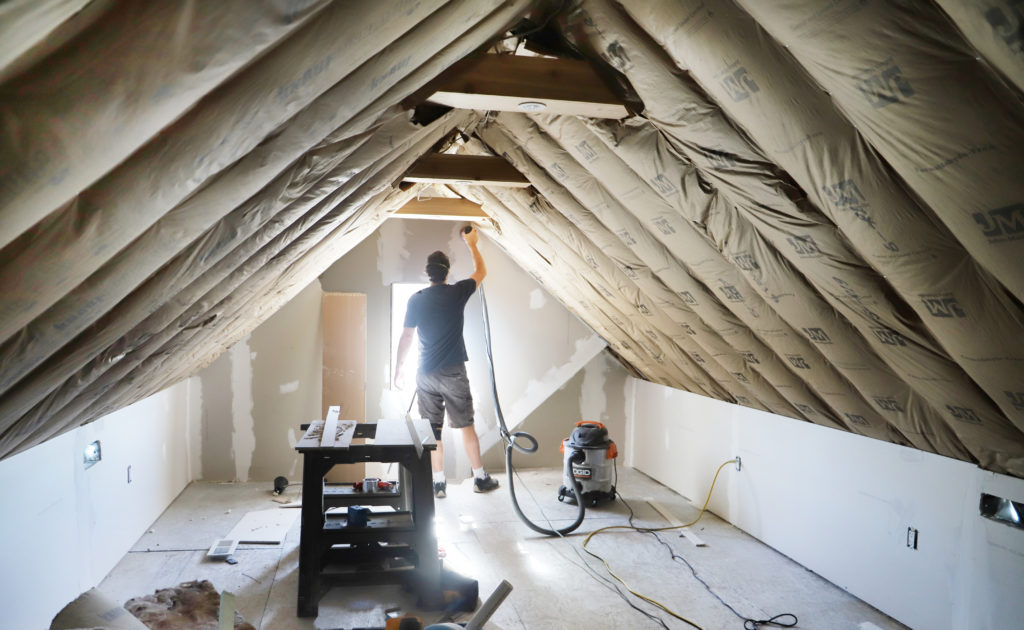 sanding and finishing drywall in attic office space