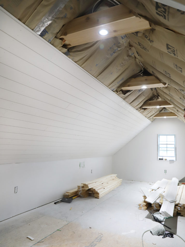 shiplap board installed on the ceiling of the attic office