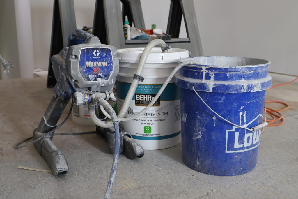 using an airless sprayer to paint the attic office