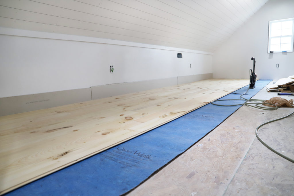 Installing the first few floors of pine wood in the attic office