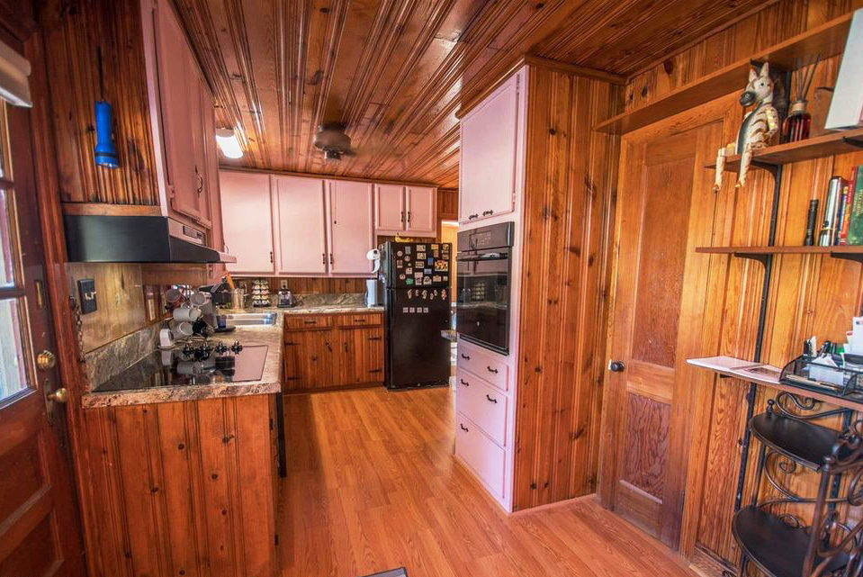 New house Kitchen needs renovation wood paneling