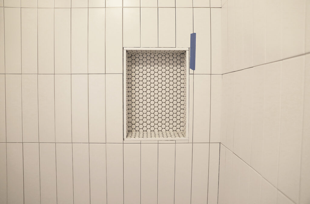 Shower niche with gloss penny tile