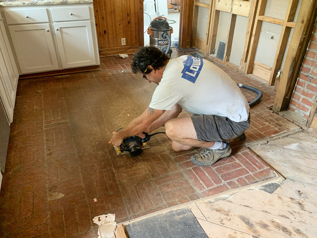 Sawing through the kitchen floor during demo