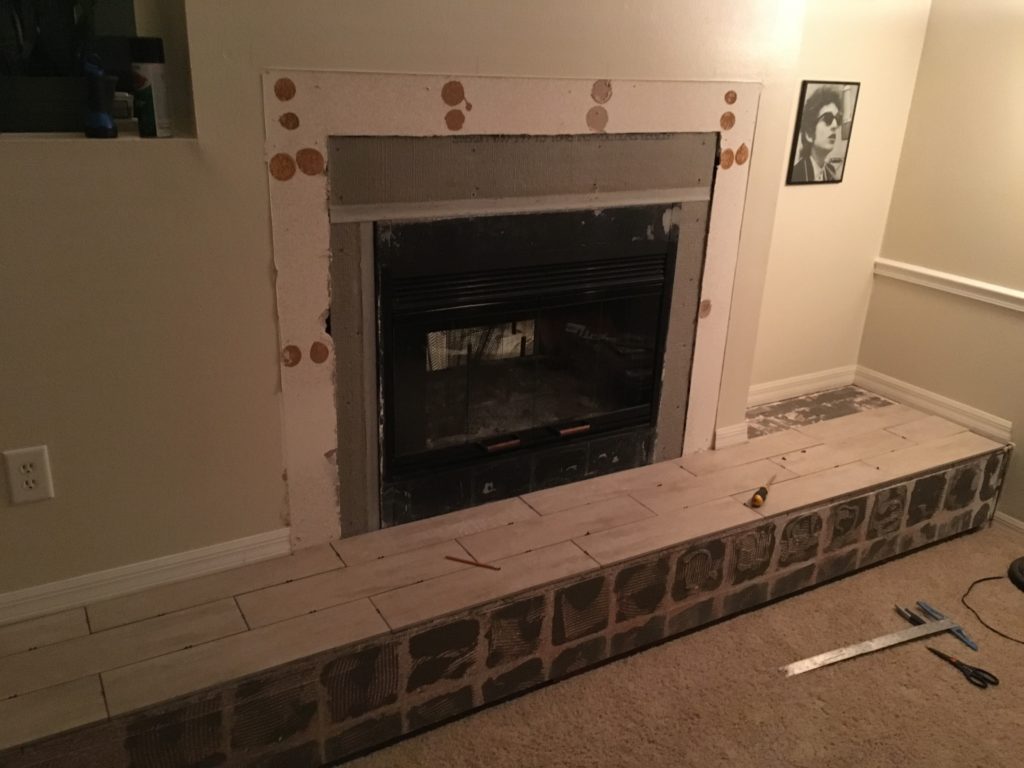 New hearth tile installed and new tile backer board installed around fireplace